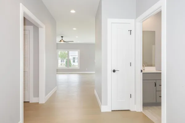a view of a hallway with windows
