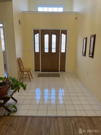 a view of a hallway and wooden floor in a livingroom