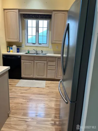 a view of a room with wooden floor