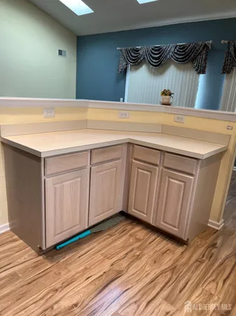 a view of a room with window wooden floor and windows