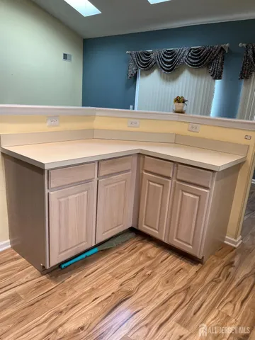 a view of a room with window wooden floor and windows