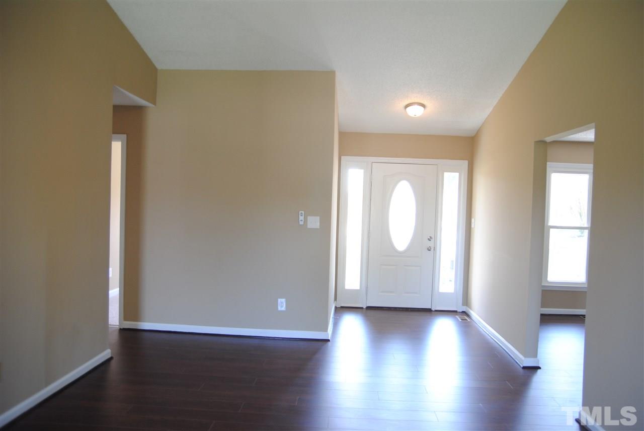 1821 Billingham Court Raleigh, NC 27604 - Photo 3 of 14 an empty room with wooden floor and windows