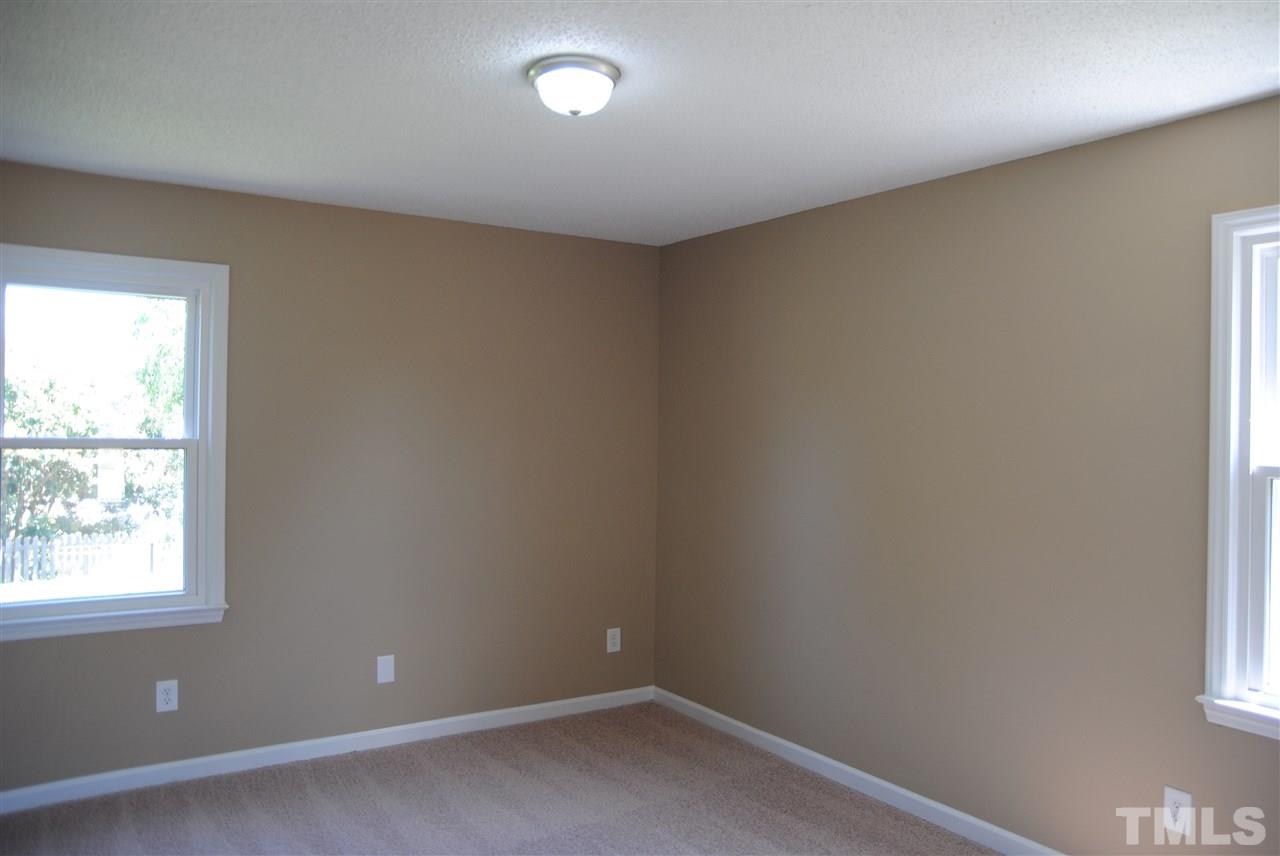 1821 Billingham Court Raleigh, NC 27604 - Photo 8 of 14 an empty room with a window