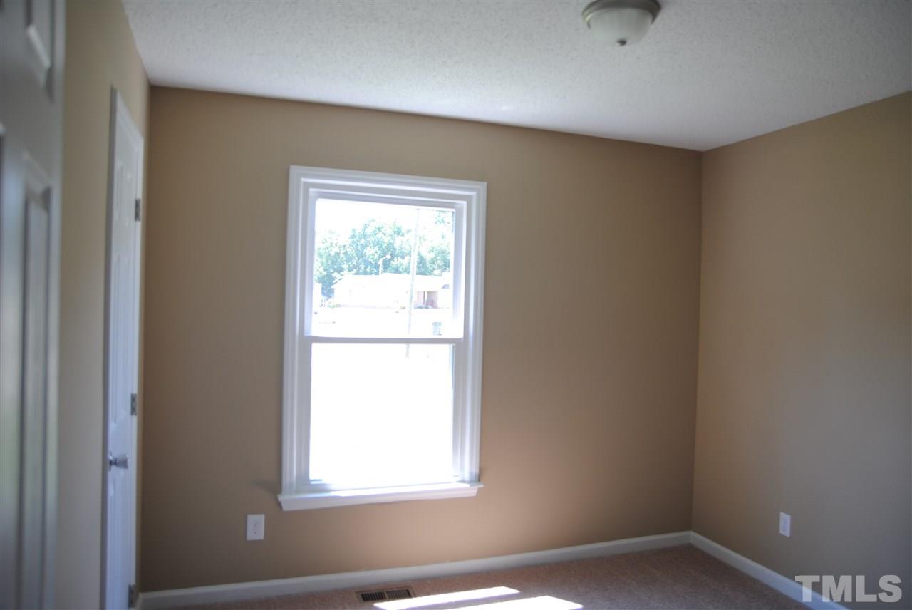 1821 Billingham Court Raleigh, NC 27604 - Photo 10 of 14 an empty room with a window