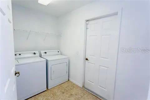 8276 Short Way Lakeland, FL 33809 - Photo 10 of 12 a utility room with dryer and washer
