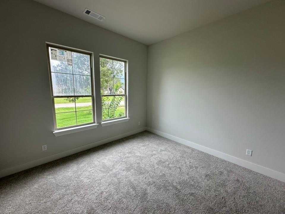 410 Cobb Road Leonard, TX 75452 - Photo 18 of 24 Room featuring plush gray carpeting, neutral wall paint, and white baseboards