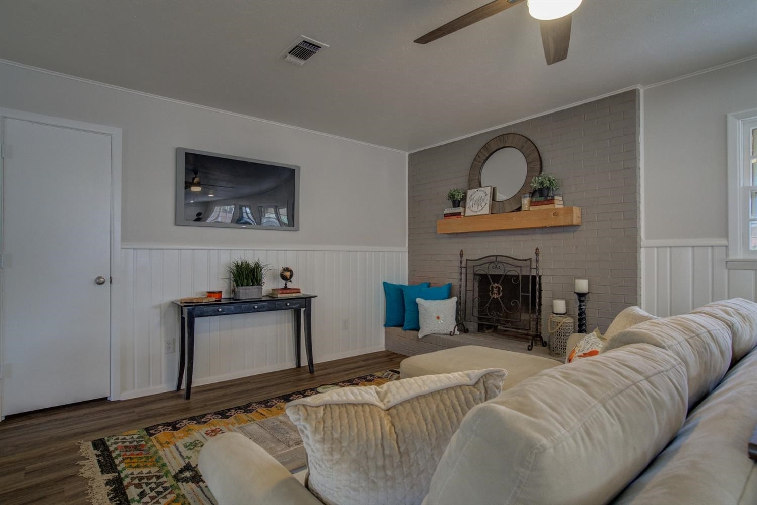 2311 61st Street Lubbock, TX 79412 - Photo 19 of 32 a living room with furniture and a fireplace