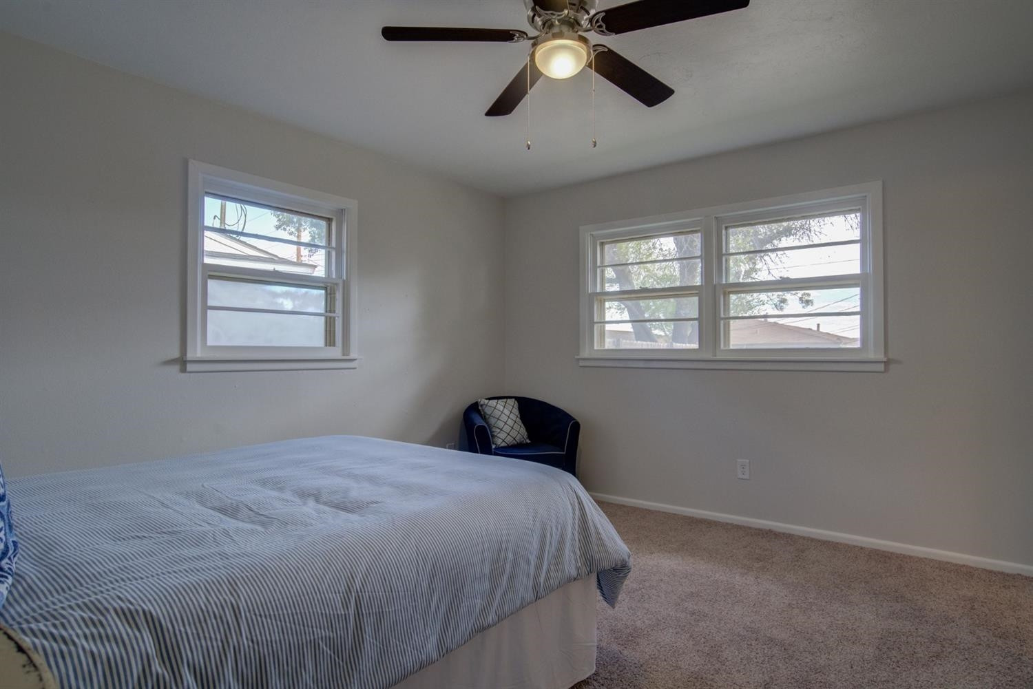 2311 61st Street Lubbock, TX 79412 - Photo 22 of 32 a bedroom with a bed and window with window