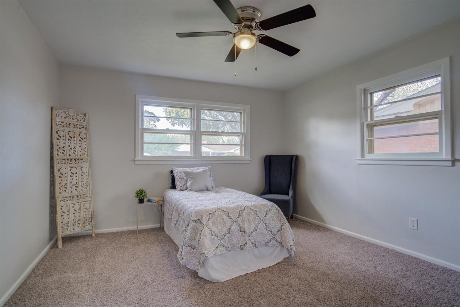 2311 61st Street Lubbock, TX 79412 - Photo 25 of 32 a bedroom with a bed and a window