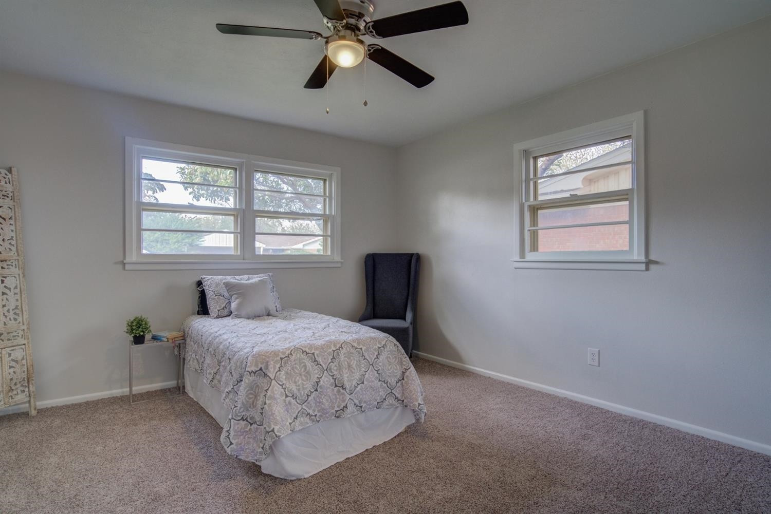 2311 61st Street Lubbock, TX 79412 - Photo 26 of 32 a bedroom with a bed and a window