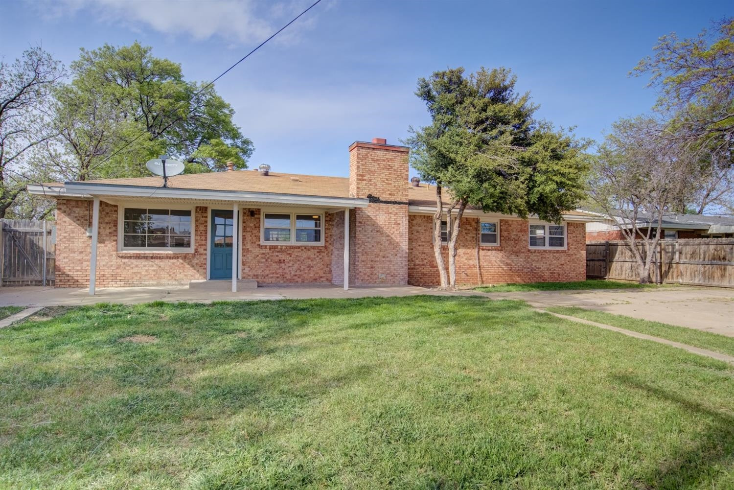 2311 61st Street Lubbock, TX 79412 - Photo 32 of 32 a view of a house with backyard porch and garden
