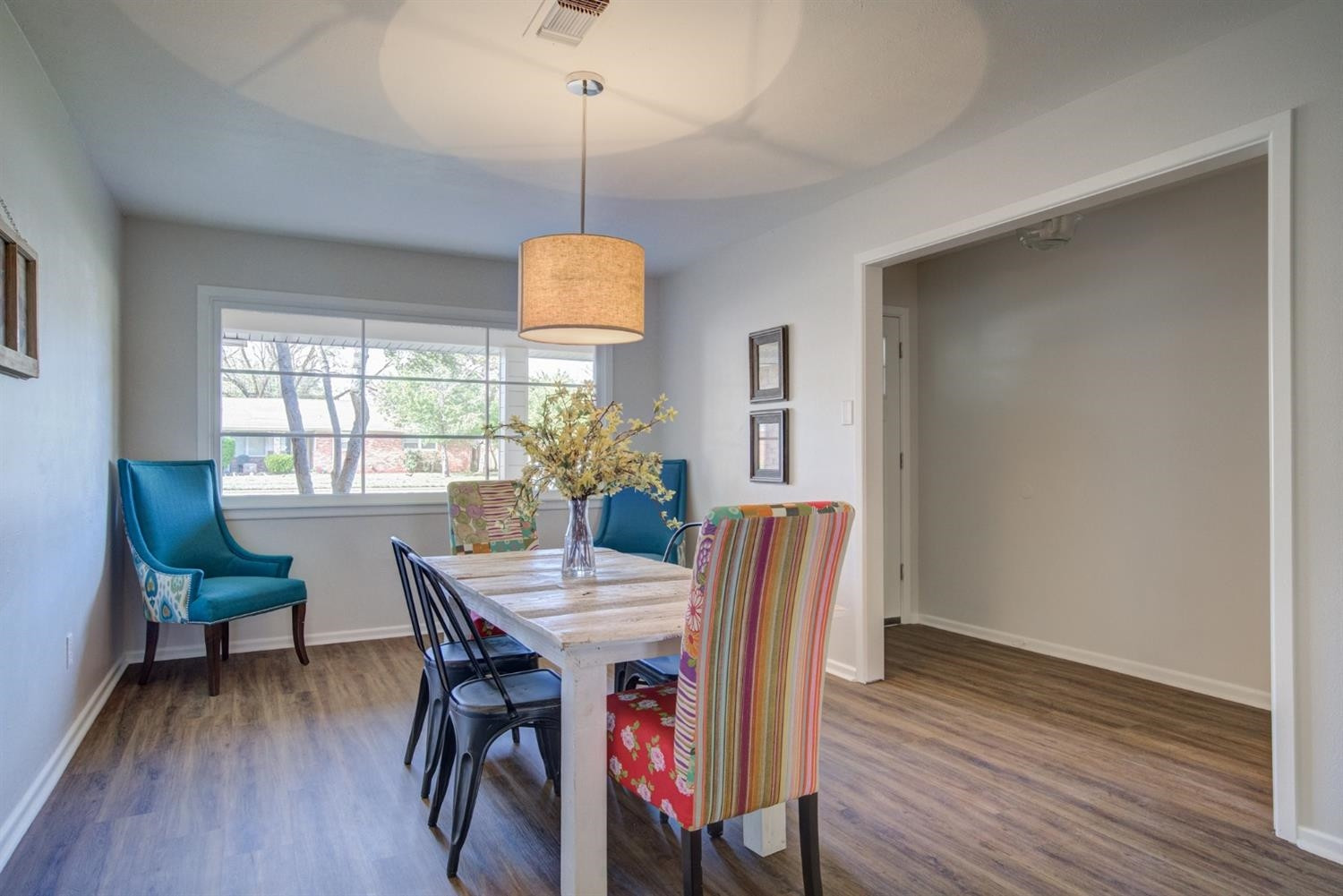 2311 61st Street Lubbock, TX 79412 - Photo 5 of 32 a view of a dining room with furniture window and wooden floor