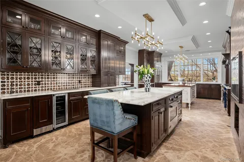 a kitchen with stainless steel appliances granite countertop a sink counter space and wooden floor