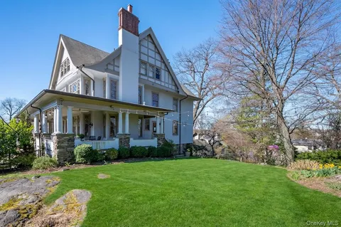 an aerial view of a house with a garden