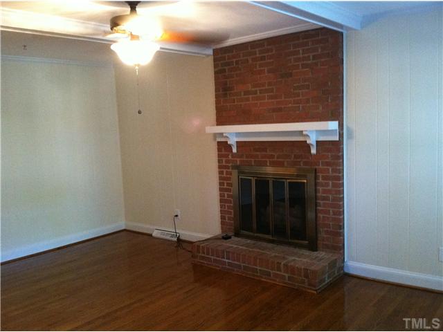 3504 Ranlo Drive Raleigh, NC 27612 - Photo 2 of 10 a living room with a fireplace