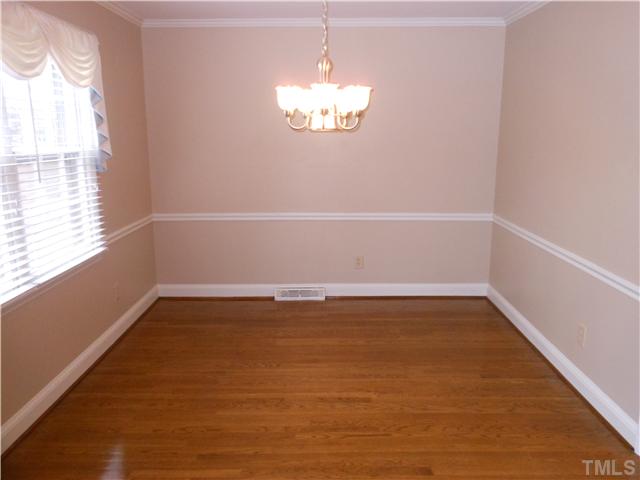 3504 Ranlo Drive Raleigh, NC 27612 - Photo 3 of 10 a view of a room with window and wooden floor
