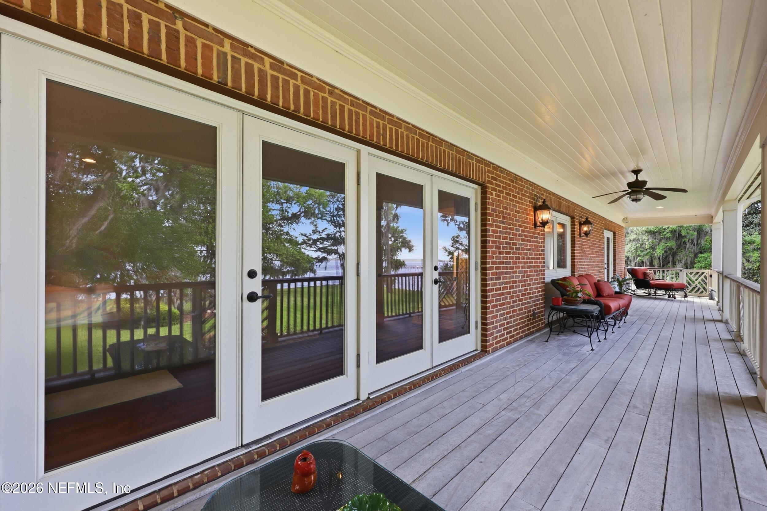 13200 Mandarin Road Jacksonville, FL 32223 - Photo 118 of 173 a view of a house with porch and wooden floor