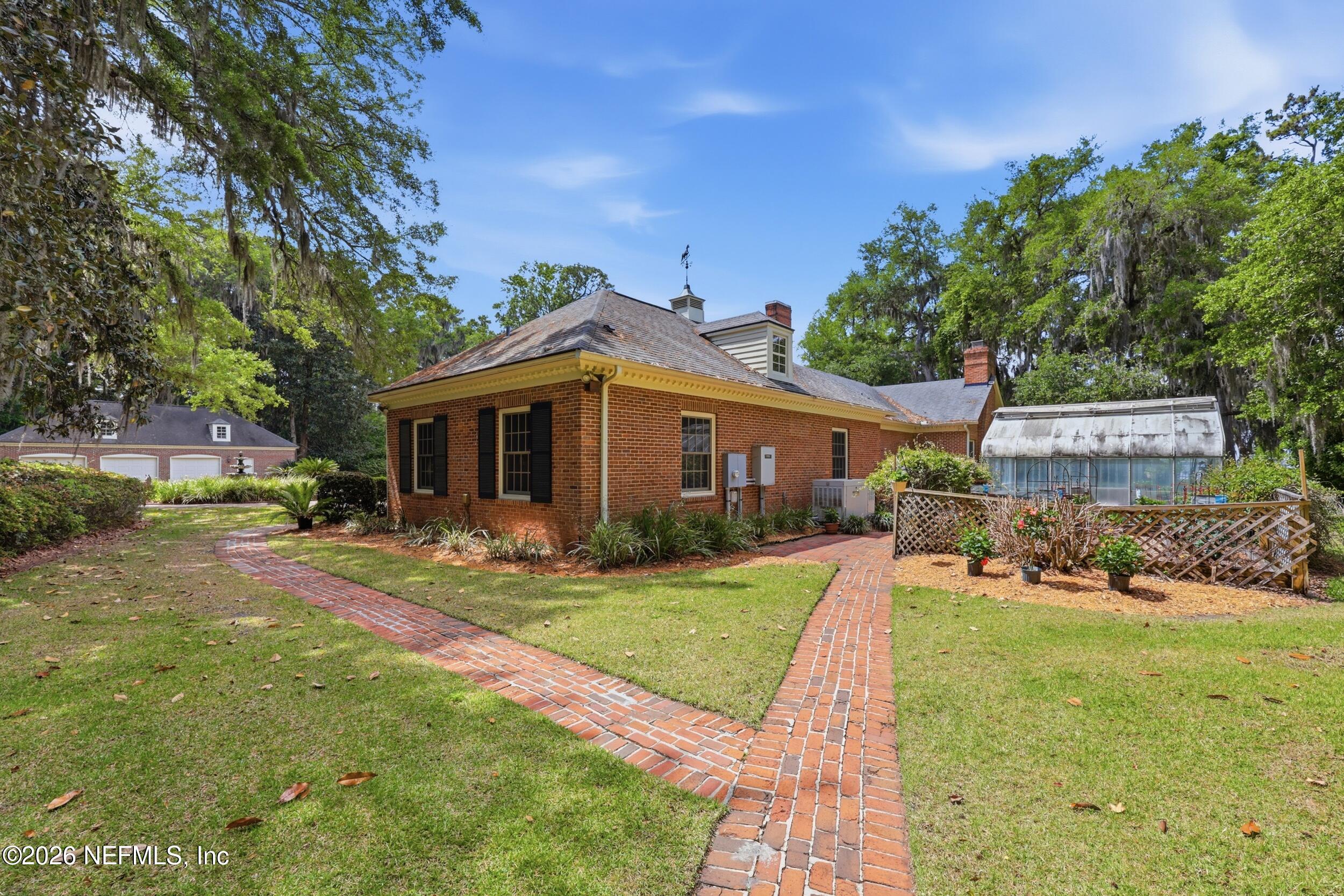 13200 Mandarin Road Jacksonville, FL 32223 - Photo 128 of 173 PATH TO GARAGE AND GREEN HOUSE