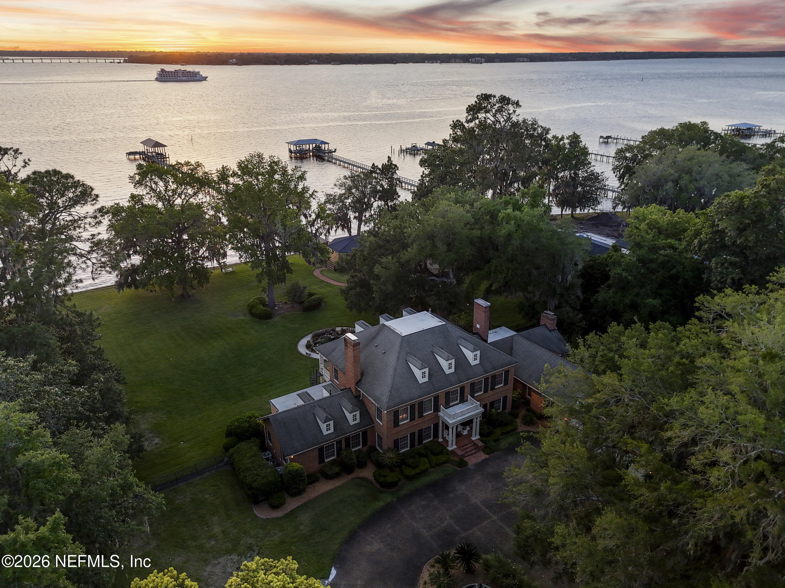 13200 Mandarin Road Jacksonville, FL 32223 - Photo 165 of 173 an aerial view of a house with a garden and lake view