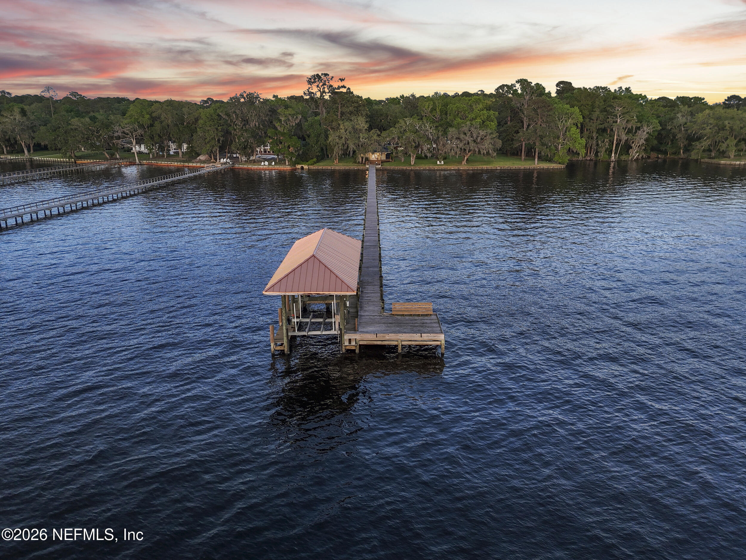 13200 Mandarin Road Jacksonville, FL 32223 - Photo 170 of 173 a backyard of a house with lots of green space and lake view