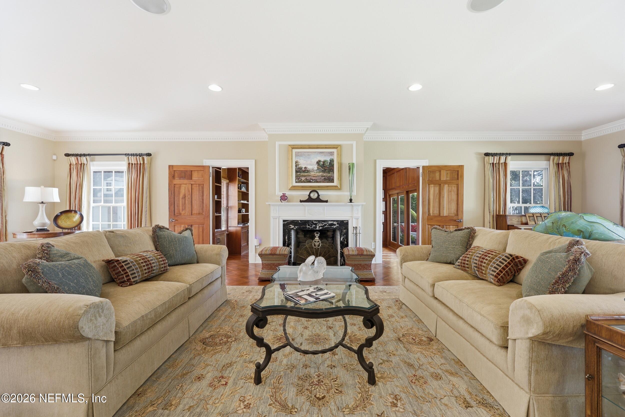 13200 Mandarin Road Jacksonville, FL 32223 - Photo 24 of 173 a living room with furniture and a fireplace