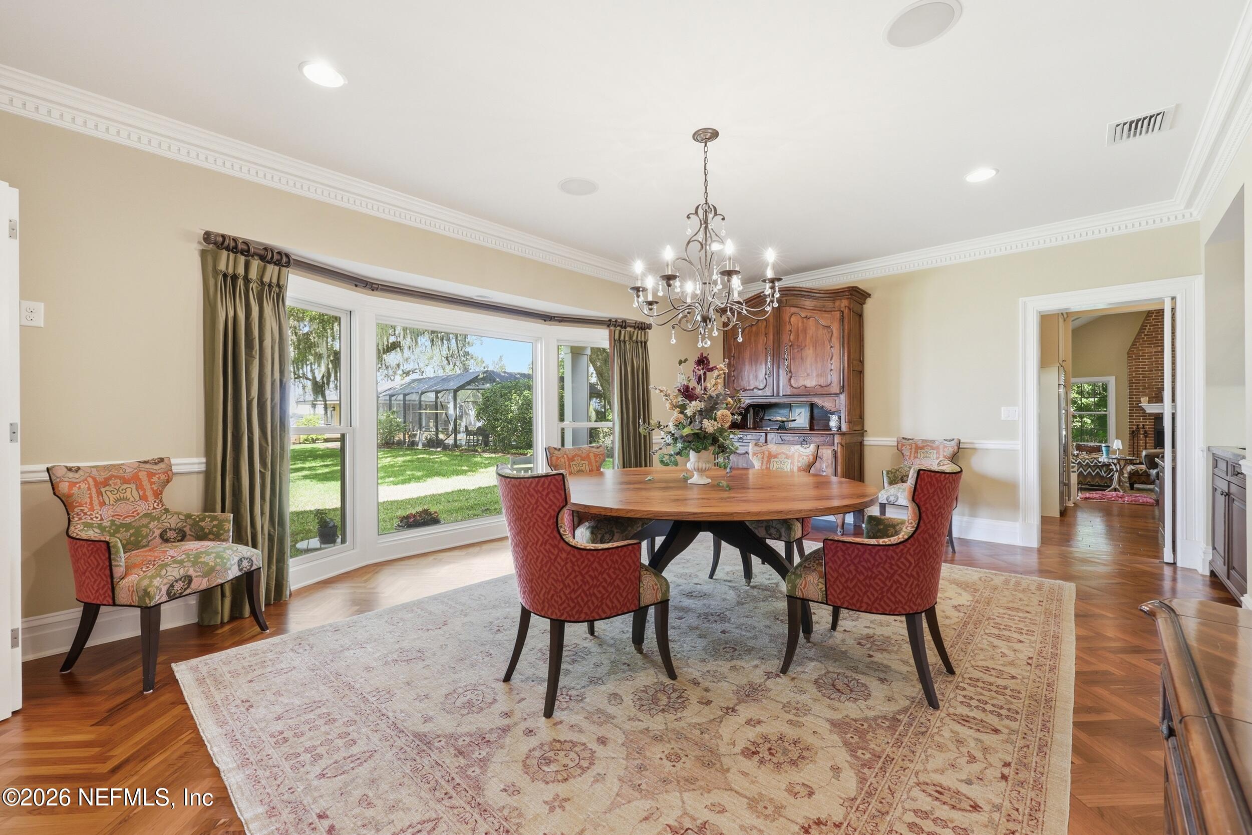 13200 Mandarin Road Jacksonville, FL 32223 - Photo 36 of 173 a view of a dining room with furniture window and wooden floor