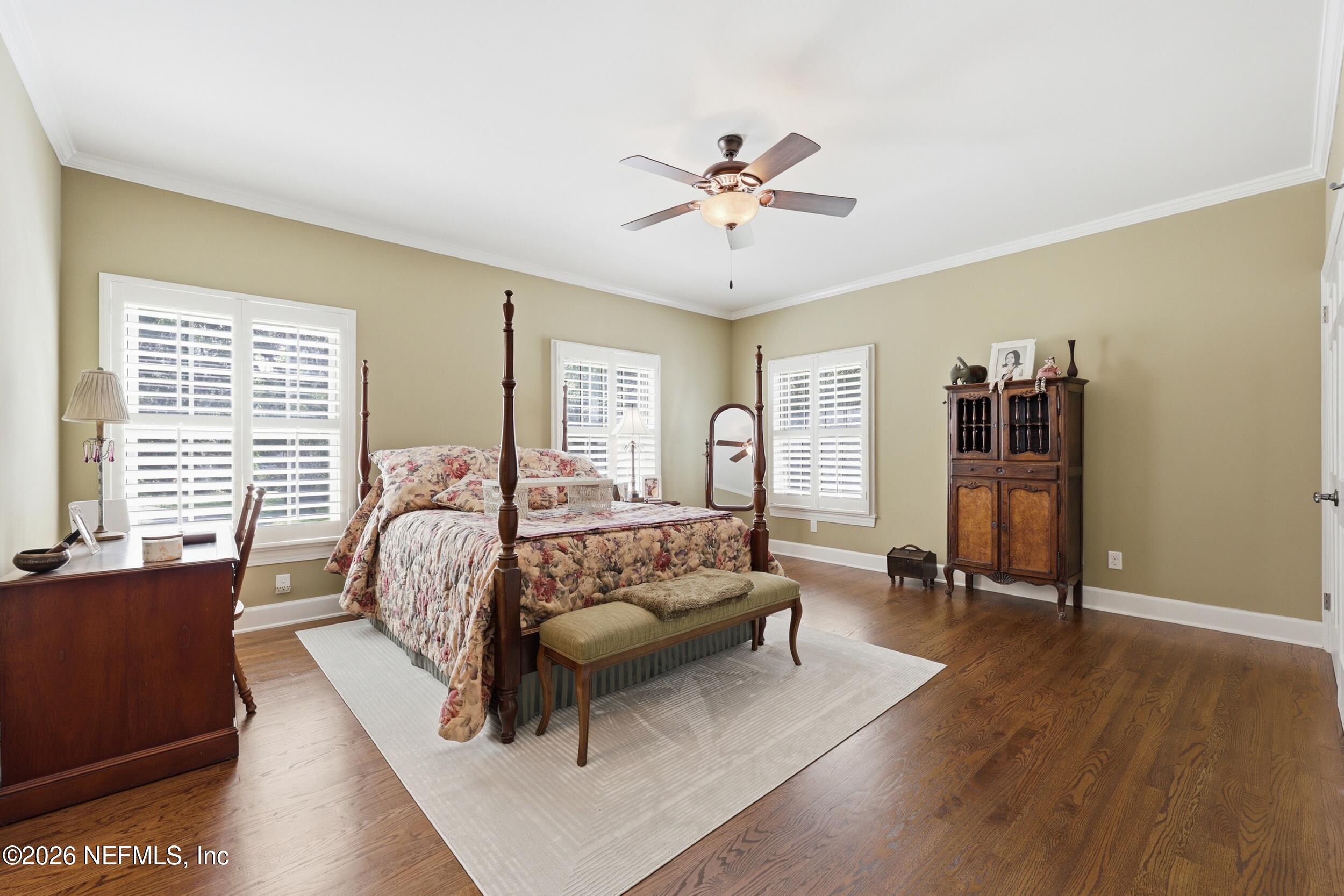 13200 Mandarin Road Jacksonville, FL 32223 - Photo 69 of 173 a spacious bedroom with a bed and wooden floor
