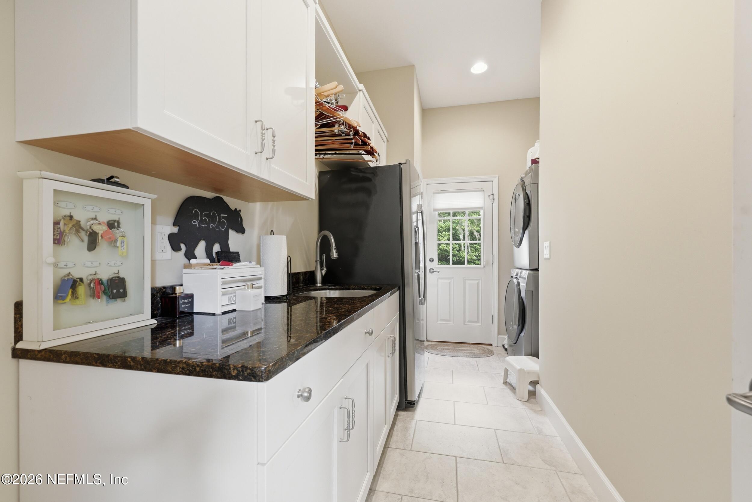 13200 Mandarin Road Jacksonville, FL 32223 - Photo 74 of 173 a kitchen with stainless steel appliances granite countertop a sink and a refrigerator