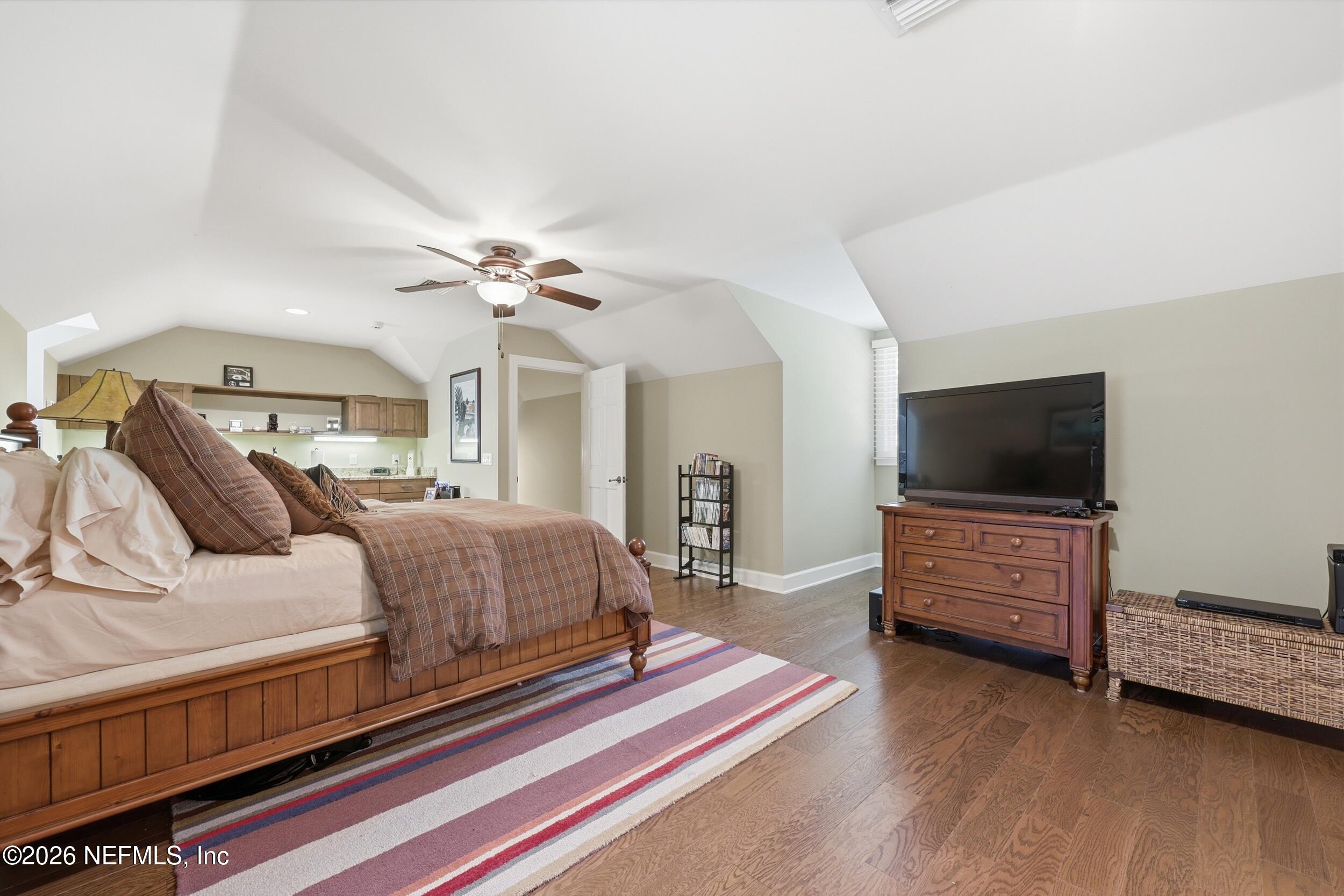 13200 Mandarin Road Jacksonville, FL 32223 - Photo 77 of 173 a spacious bedroom with a bed and a flat screen tv