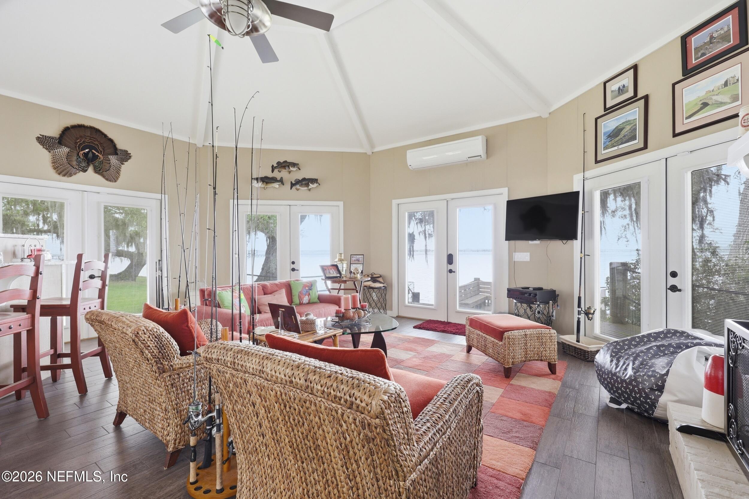 13200 Mandarin Road Jacksonville, FL 32223 - Photo 93 of 173 a living room with furniture ceiling fan and a rug