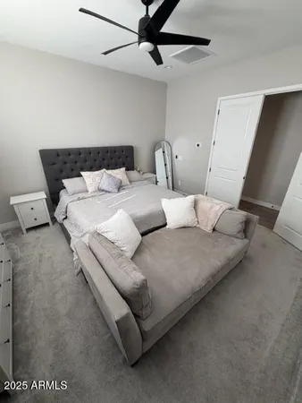 a bathroom with a double vanity sink a mirror and a shower