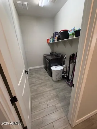 a bedroom with a bed and cabinets