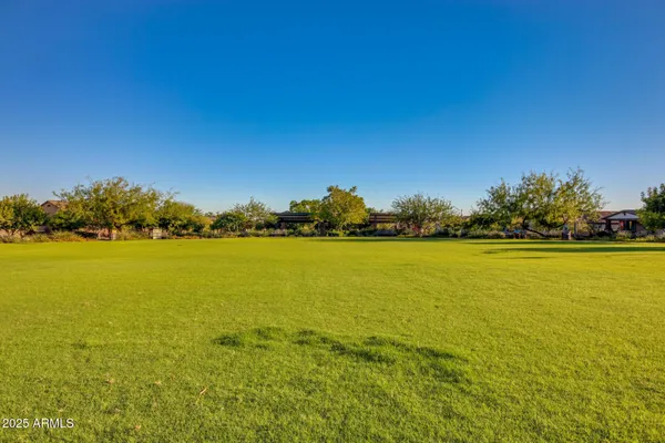 a living room with furniture a rug and a large window