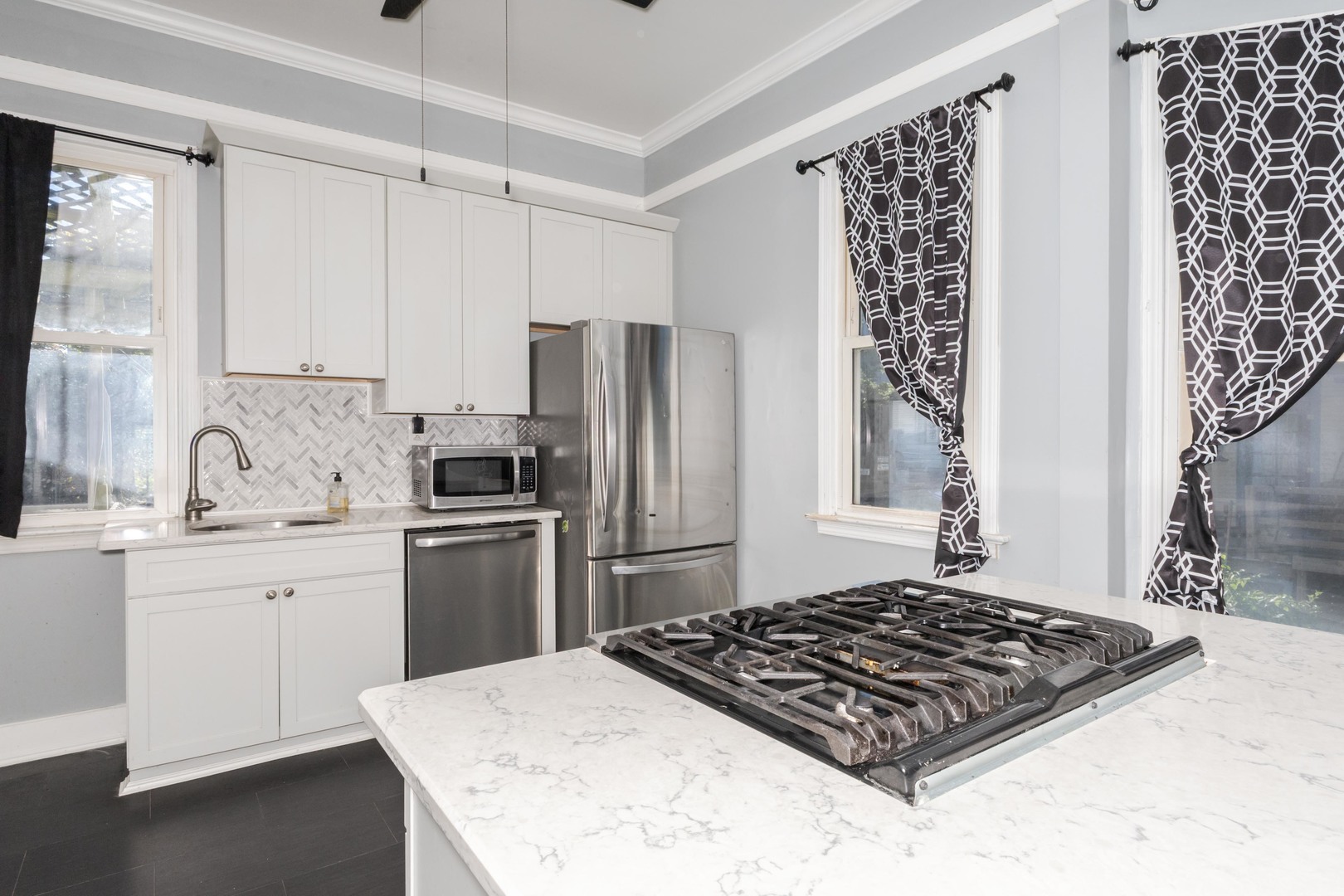 904 South Madison Street Bloomington, IL 61701 - Photo 13 of 46 a kitchen with a stove a sink and a refrigerator