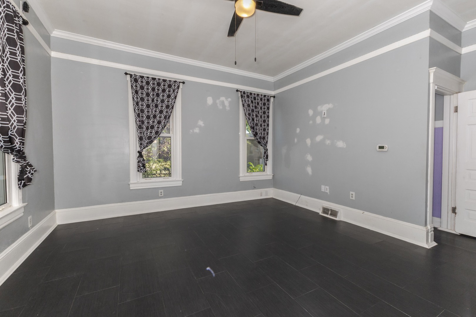 904 South Madison Street Bloomington, IL 61701 - Photo 15 of 46 an empty room with wooden floor and windows