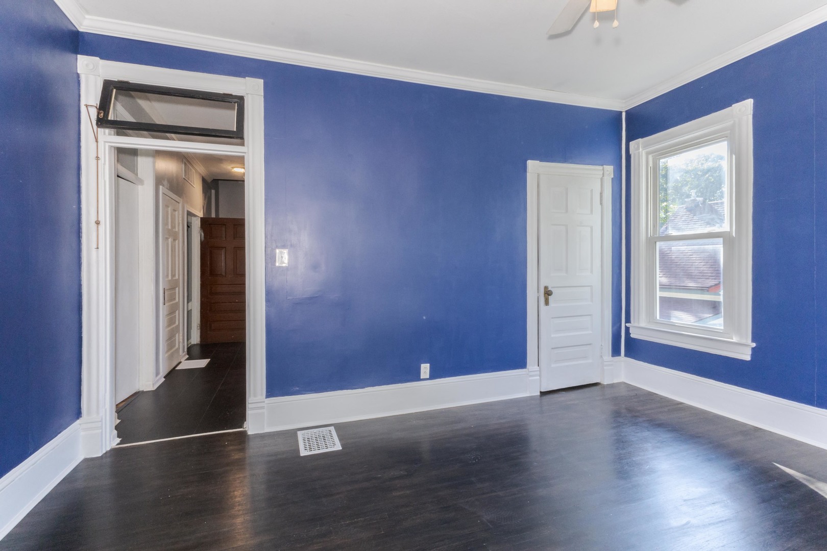 904 South Madison Street Bloomington, IL 61701 - Photo 21 of 46 an empty room with wooden floor and windows