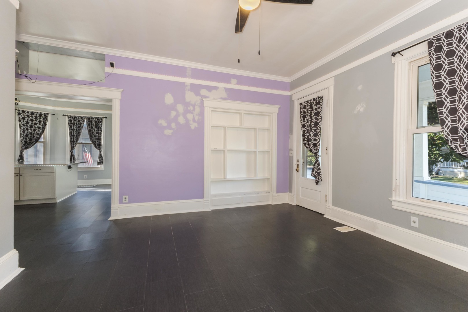 904 South Madison Street Bloomington, IL 61701 - Photo 25 of 46 a view of a livingroom with wooden floor and a window