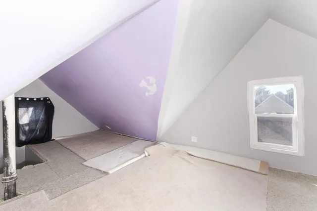 a view of an empty room and window