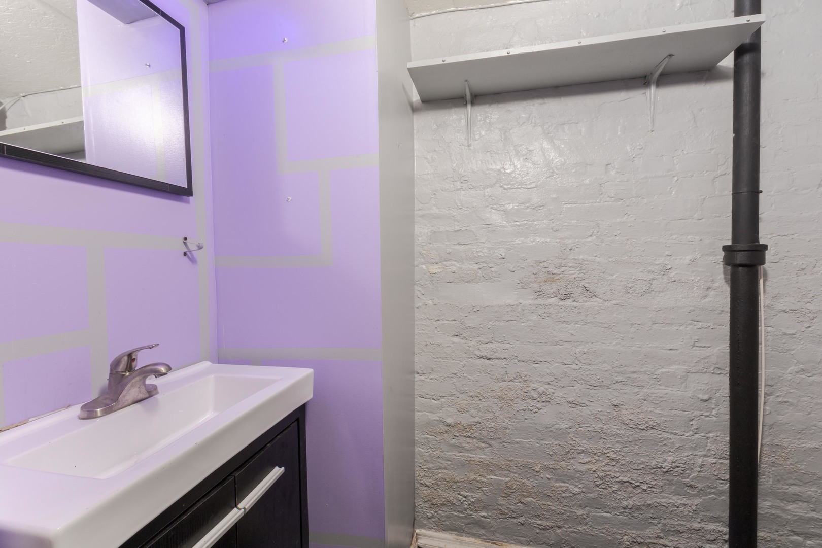 904 South Madison Street Bloomington, IL 61701 - Photo 31 of 46 a bathroom with a sink and a mirror