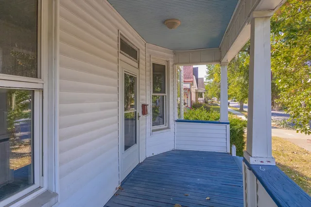 a view of hallway with wooden floor