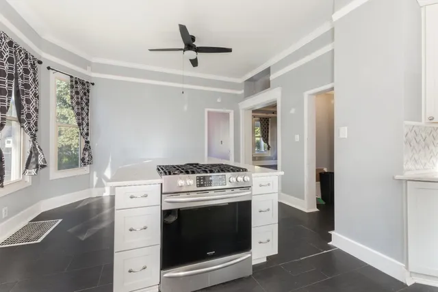 a kitchen with a stove and a sink
