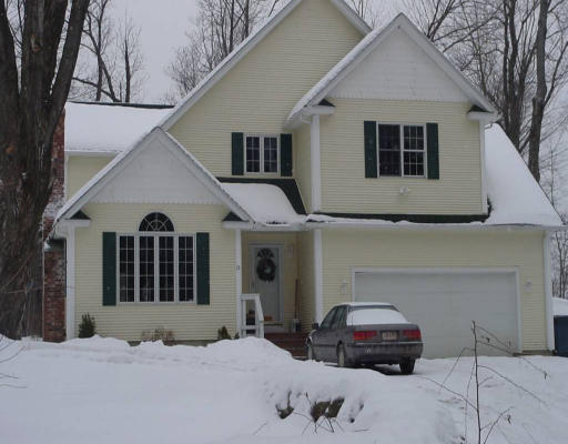 15 Polly Road Holland, MA 01521 - Photo 1 of 3 a car parked in front of white house