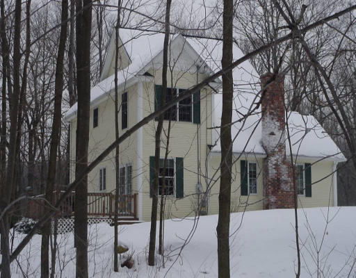 15 Polly Road Holland, MA 01521 - Photo 2 of 3 a view of a house with a snow in the yard