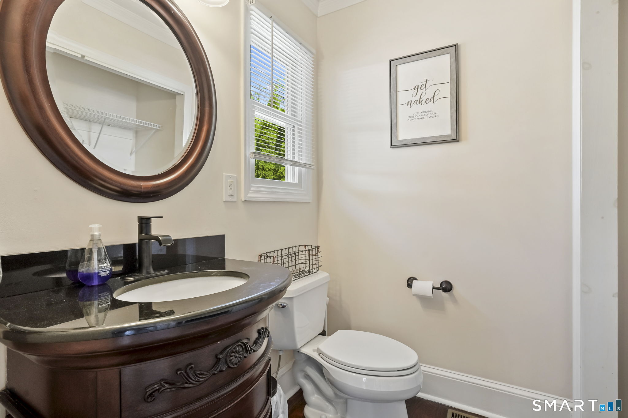 315 Church Hill Road Trumbull, CT 06611 - Photo 16 of 40 a bathroom with a sink and a mirror