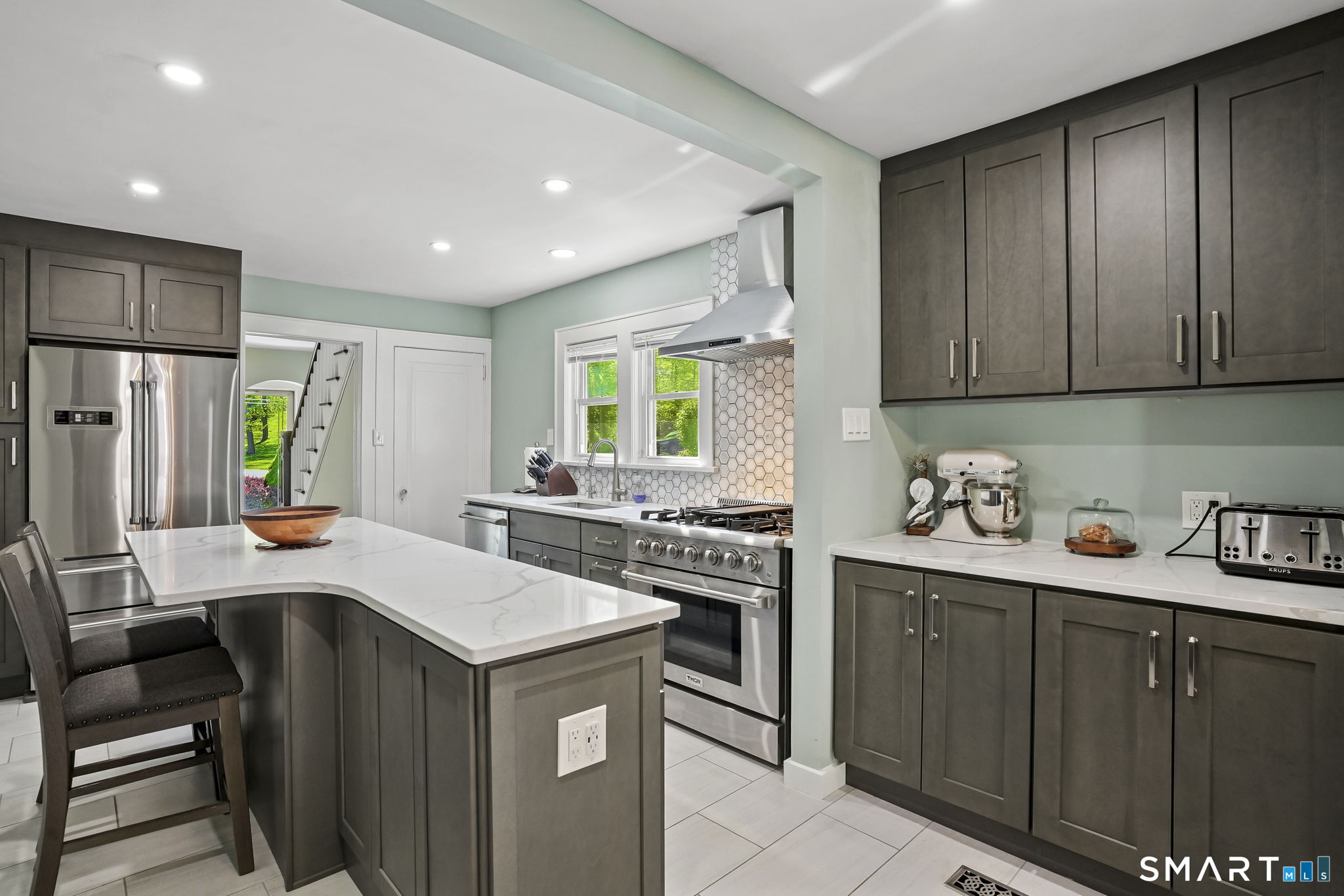 315 Church Hill Road Trumbull, CT 06611 - Photo 18 of 40 a kitchen with a stove a sink a refrigerator and cabinets