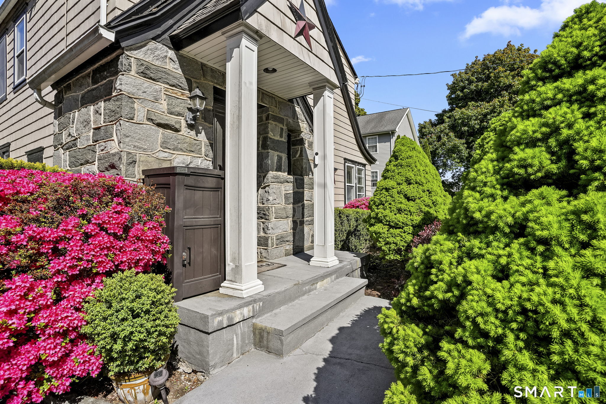 315 Church Hill Road Trumbull, CT 06611 - Photo 2 of 40 a view of a house with a flower garden