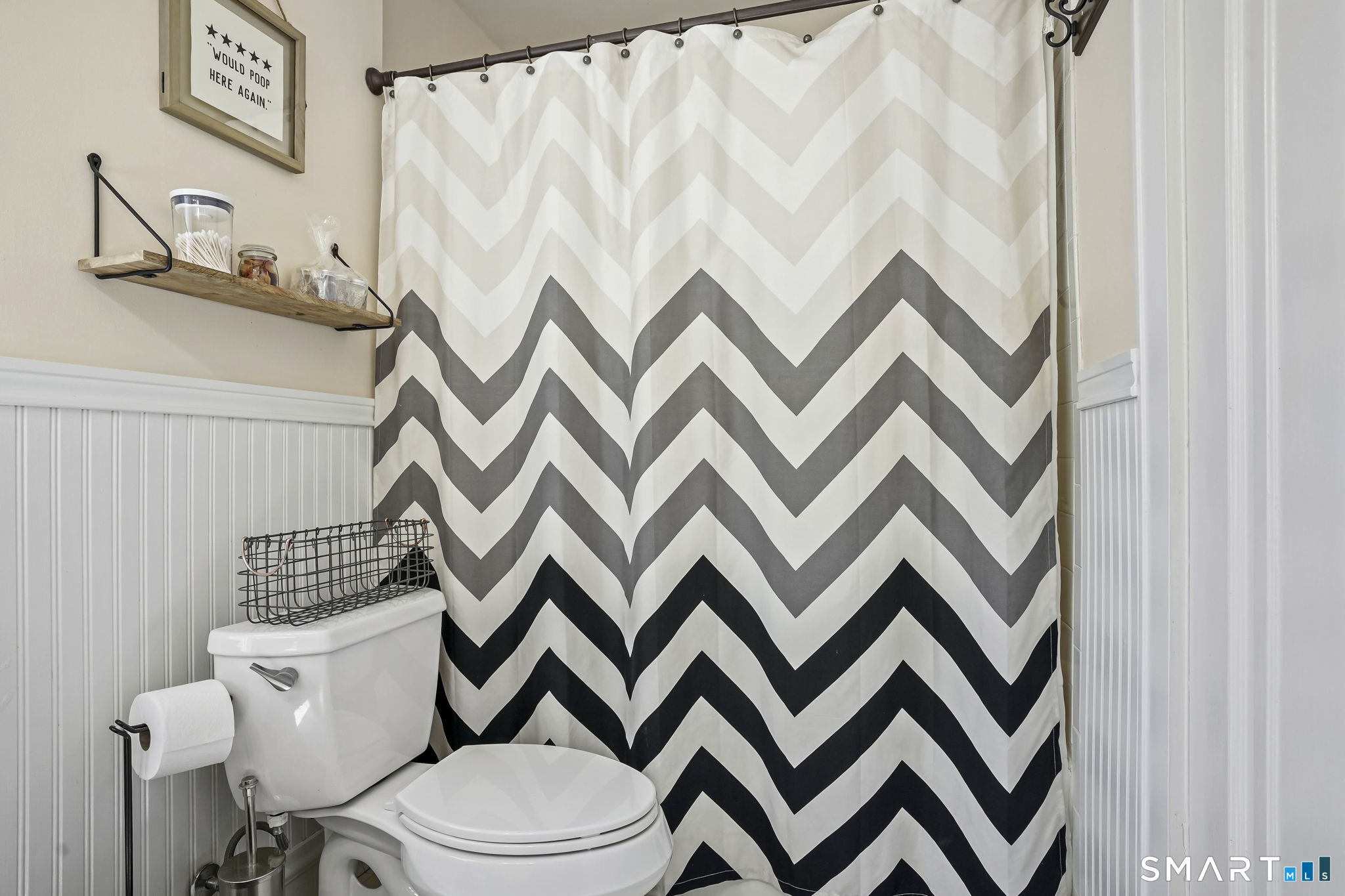 315 Church Hill Road Trumbull, CT 06611 - Photo 24 of 40 a white toilet sitting next to a shower curtain