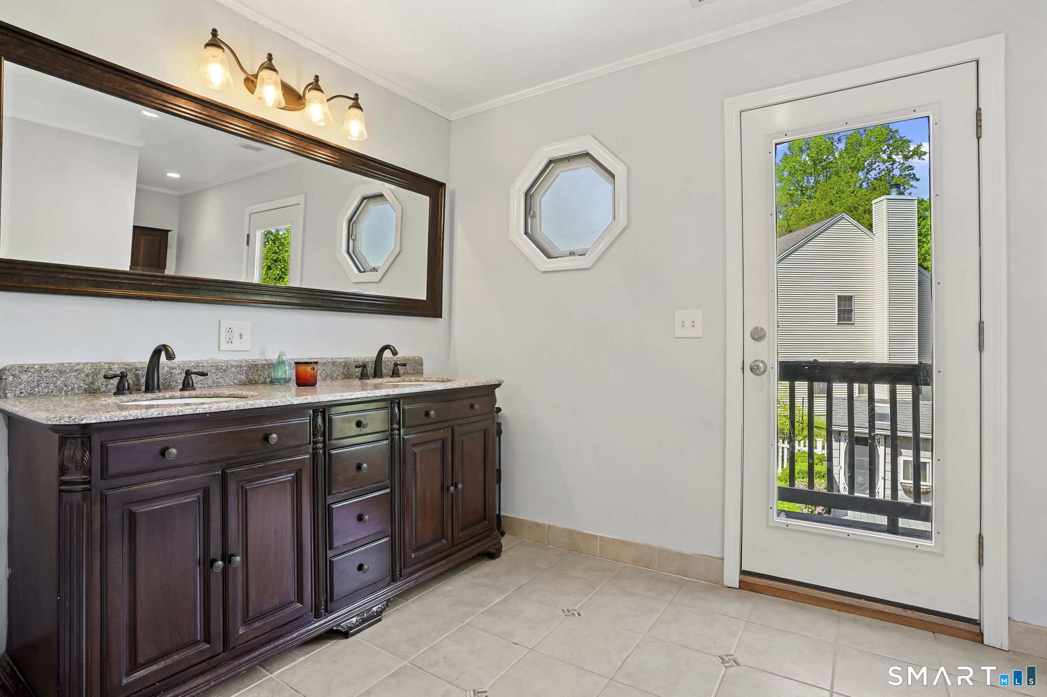 315 Church Hill Road Trumbull, CT 06611 - Photo 34 of 40 a spacious bathroom with a granite countertop sink and a mirror