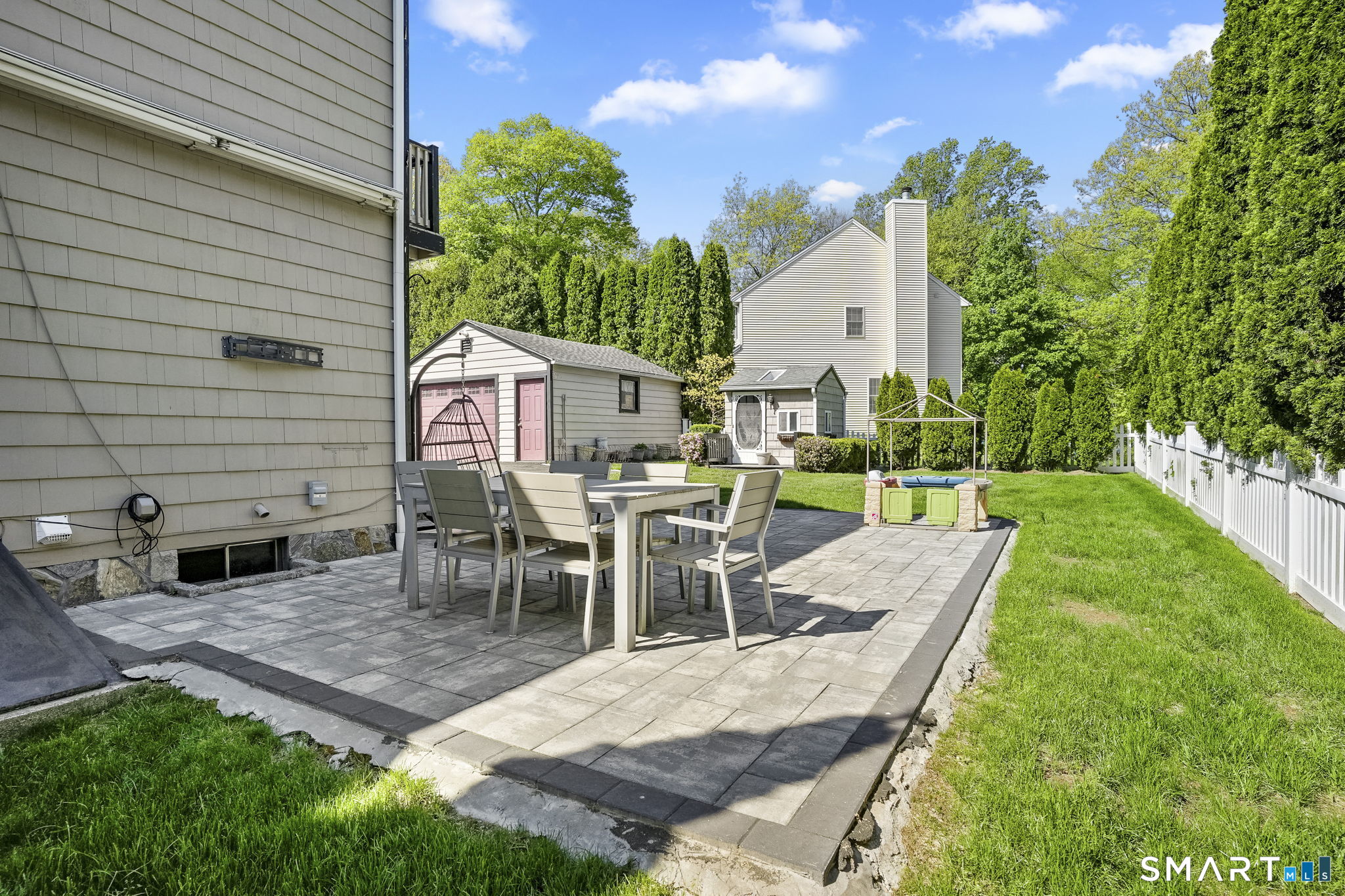 315 Church Hill Road Trumbull, CT 06611 - Photo 37 of 40 a view of a patio with table and chairs and potted plants