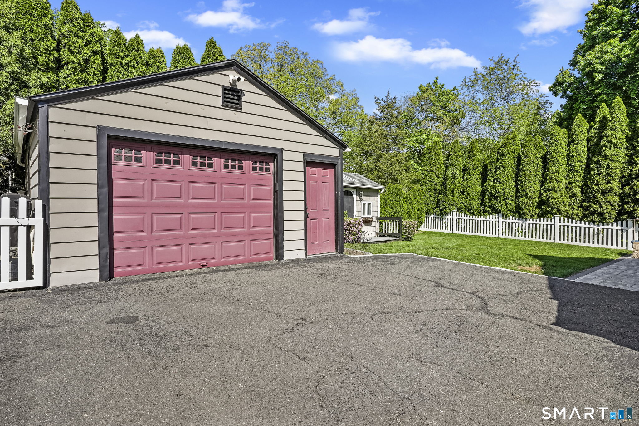 315 Church Hill Road Trumbull, CT 06611 - Photo 39 of 40 a view of a house with a yard and garage